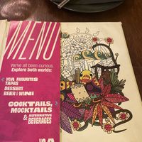The book with the menu pasted inside  at You Came Again in West End