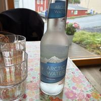 and artic water 💧   at Henningsvær Lysstøperi and Cafe in Henningsvaer