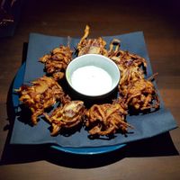 Onion bhaji with coconut coriander dip at Dumbo in Rotterdam