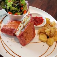 Awesome Vegan Burrito with side salad and fried potatoes at Cafe Home in Blenheim