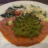 Romanesco Cauliflower with red pepper sauce and couscous 😋  at REfUSE Café in Chester-le-street