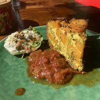 Butternut tofu quiche with chutney and Caesar salad ball  at Vegabond - West in Amsterdam