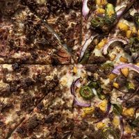 Half meat lovers & half peach pizza. Peach pizza was amazing  at Plant Based Pizzeria in Atlanta