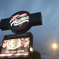 Sign visible from the road at Plant Based Pizzeria in Atlanta
