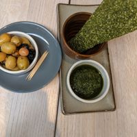 Starter, olives and dehydrated kale at Wild Food Cafe in North London
