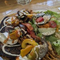 Chickpea pancakes and salad at Racines in Lausanne