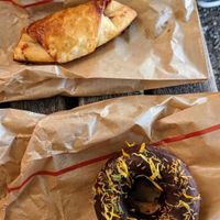 Raspberry croissant and a donut at Racines in Lausanne