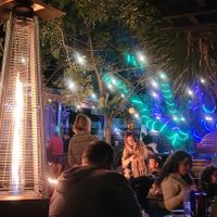 Outdoor garden seating with heat lamps for the cold season at 4th Street Fillin Station in Cocoa Beach
