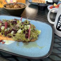 Vegan avocado toast, side of roasted potatoes. Drip coffee w/ oat milk. ✌🏻  at 4th Street Fillin Station in Cocoa Beach