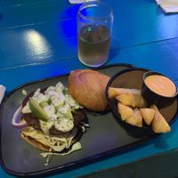 Impossible burger with a side of yuca fries and a vegan cream sauce  at 4th Street Fillin Station in Cocoa Beach