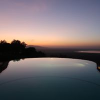Pool with a view of Lake Manyara. The restaurant provides service at the pool here too. Wonderful place to drink fresh squeezed juice in the morning.  at Flamingo in Lake Manyara National Park