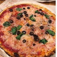 Vegan cheese pizza with spinach and black olives at Blaze Pizza in Miami