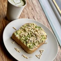 Matcha latte with avocado toast - on rosemary bread! Breakfast of champions!!! at Banana Dang in Oceanside