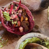 Taco Rosa with some guac and salad shoveled on  at CocoFam in Puerto Escondido