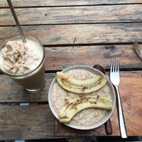 soy ice coffee and banana peanut butter oats  at Coffee Station in Phong Nha