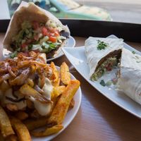 Vöner in wrap, Vöner in bread and special fries with cheesy sauce and caramelized onions at Vöner der Vegetarische Döner in Berlin