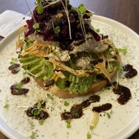 FUNK TOAST  $12
avocado. beet kraut. vegan cheese. micro greens. crispy onions. nutritional yeast. nori salt. balsamic reduction. at Organic Tree in Dana Point