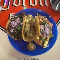 Tacos de arrachera, chicharrón en salsa verde, y piña al pastor  at Gracias Madre in Mexico City