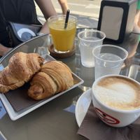vegan cornettos with strawberry jam filling, cappucino with soy milk and fresh orange juice  at Sweet Coffee Beans in Bari