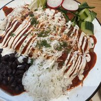 Enchilada made vegan (subbed vegan cheese and veggies)  at Hoja in Denver
