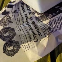 Cyrillic paper for the fish n chips at sPACYcLOUd Lounge in Washington