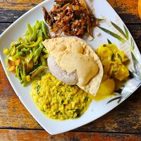 Beans- (left), eggplant- (top) and potato (right) curry and dal (bottom) at Matey Hut in Ella