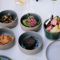 Sharing small dips at apero time at Camion in Antwerpen