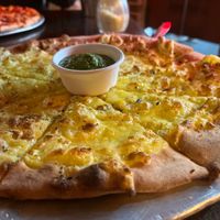 Cheesey garlic bread - comes with pesto dip. Yum!  at Fat Badgers Pizza Bar in Queenstown