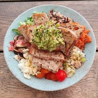 Salad topped with avocado toast at Carbon Fresh in London