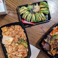 Noodles, sushi, and eggplant dish at Sun Cuisines in Buffalo
