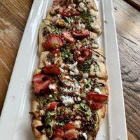 Flatbread with strawberry, arugula, tofu feta  at Ravens' Restaurant in Mendocino