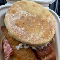 Ultimate breakfast sandwich (vegan egg, bacon, sausage, cheese, hash brown, mayo, and finally French toast sticks placed on the top of it all) at Plant Slayer in Fresno