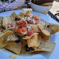 Vegan chicken nachos (minus jalepeños) a little spicy for me but I can't handed my spicy lol it was so yummy. at The Point Pub & Grill in Central Point