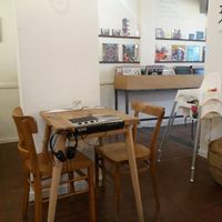 Table with build in tape player + choice of vinyls and tapes to listen to during dinner or just to enjoy :) at Super Fourchette in Brussels