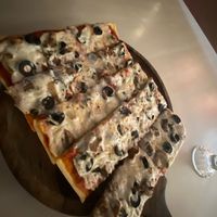 Thin crust cashew cheese, black olives, and  mushrooms  at Renaissance in Manali