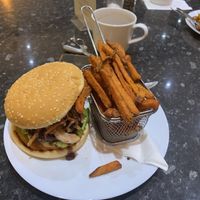 Burger and fries  at Dynamite Raw Cafe in Bury