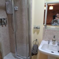 Modern bathroom with under floor heating and heated towel rail at Nab Cottage in Bexhill