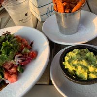 Watermelon salad with sweet potato fries and guac  at Quinn's on the Beach in Marco Island