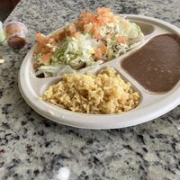 Quesadilla plate with refried beans .  at Veegos in Houston