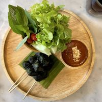 Roasted mushrooms wrapped in betal leaves satay at Tonklar Facai - Chula in Bangkok