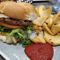 Impossible burger with curly fries at Collision Brewing Company and Restaurant in Longmont