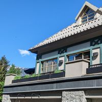 Looking up at the windows that diners look out of at Earls Kitchen + Bar in Whistler