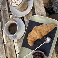 Croissant with raspberry jam, Americano, Iced Coffee  at Veganika in Ljubljana