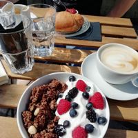 Homemade granola with coconut yogurt and croissant with jam at Veganika in Ljubljana