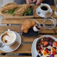 Latte, granola, croissant, tofu sandwhich at Veganika in Ljubljana