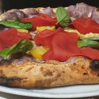 Vegan pizza with vegan ham, tomatoes, purple potato and basil at Frankie's in Sorrento