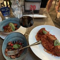 Vegan spaghetti with lentil meatballs + roasted eggplant and peppers on the sidee  at Frankie's in Sorrento
