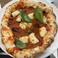 Vegan pizza with eggplant, smoked cheese, lentil sauce, and stuffed with lentil meatballs and ricotta   at Frankie's in Sorrento