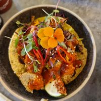 Vegan Taco: Plantbased crispy chickaan, aromatic cauliflower, corn tortilla, holy guacamole, picked carrot, apple & mango slaw, coriander, chilli oil, tamarind, & red pepper sauce at Viet Shack in Manchester