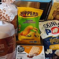 Some vegan items on 3/15/26 (Limited Edition butterbeer popcorn, gluten-free bread, and other snacks) at Sprouts Farmers Market in Naples